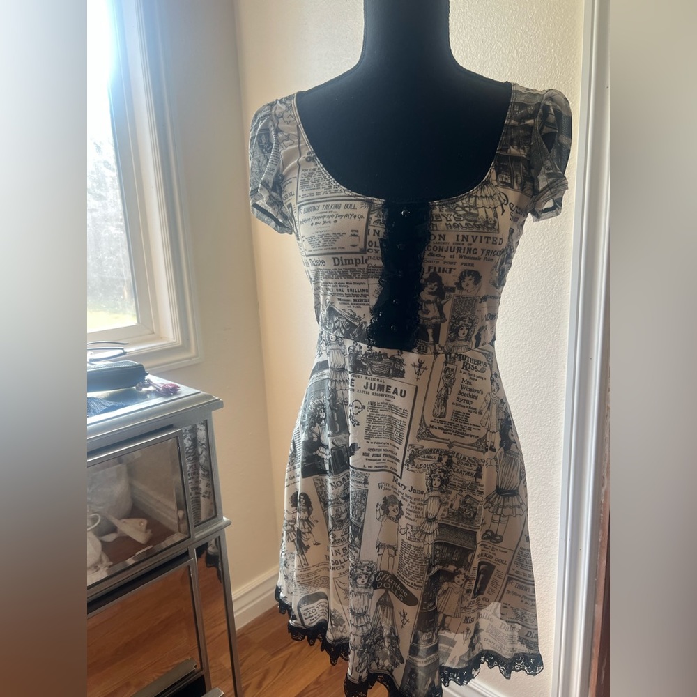 Dolls Kill x Widow “newspaper print” dress